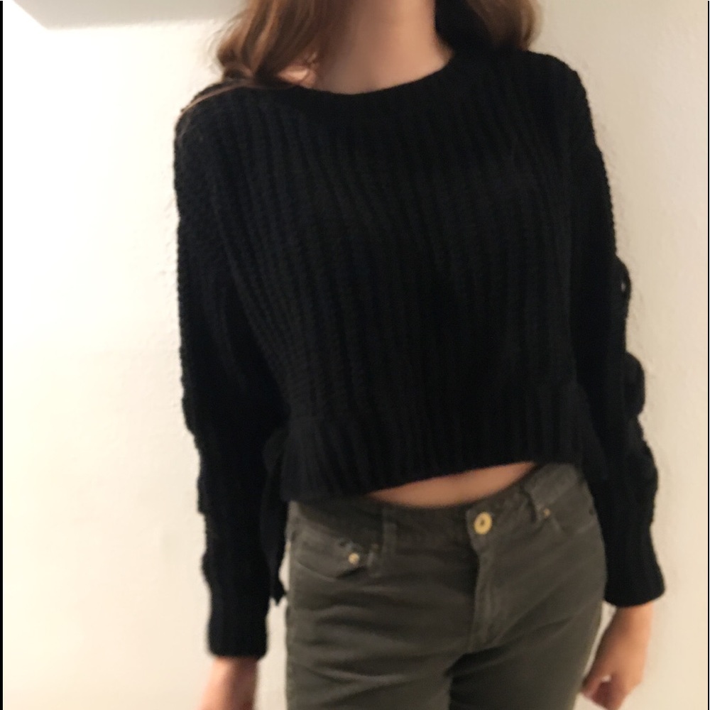 Black cropped sweater w/ crisscross sleeves & ties